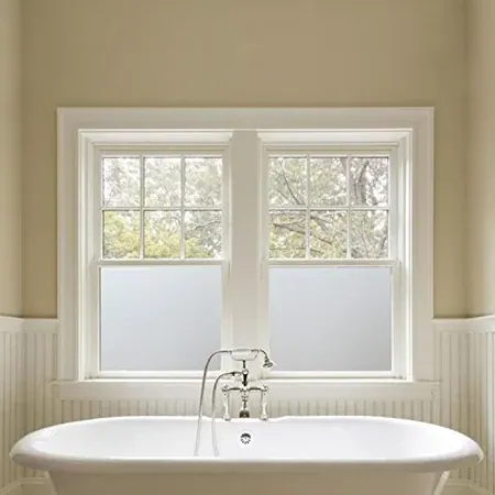 Bathroom window with white opaque privacy film