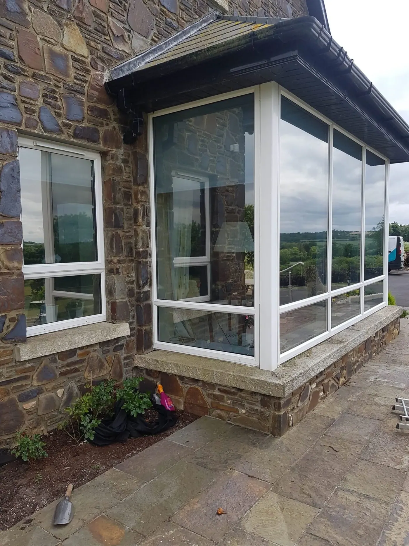 Home window with lightly tinted Rayno window film